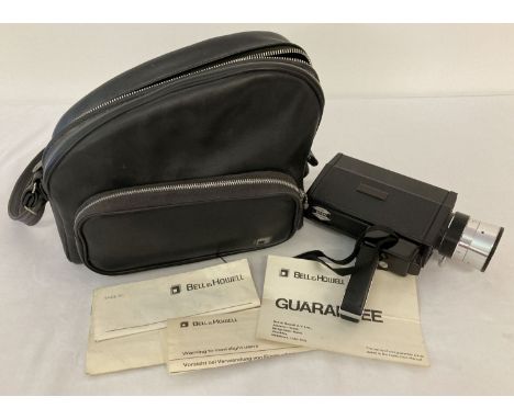 A vintage 1970's Bell &amp; Howell 491 Autoload Focus-Matic Super 8 camera. Complete with original instruction manual and bla