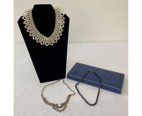 3 vintage necklaces. A diamante necklace set with amber and yellow stones. Together with a small black glass bead multistrand