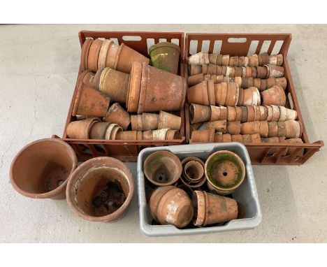 A large quantity of vintage terracotta plant pots in varying sizes and condition.  