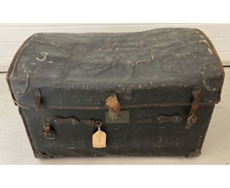 A large dome topped leather trunk with carry handles by B.Barrett Brothers, 426 Oxford Street West. Painted name to top "Loui