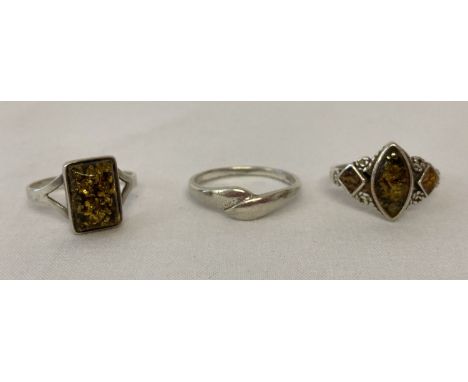 3 silver dress rings. 2 set with green amber and a twist style band ring. All marked 925. Sizes R, Q and T½. 