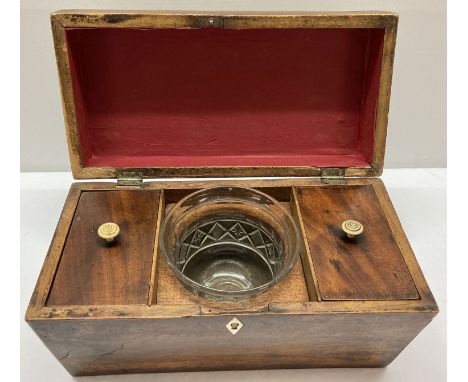 A Victorian sarcophagus tea caddy with fitted interior. 2 lidded compartments with turned bone handles to lids. Cut glass bow