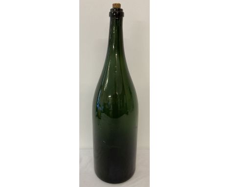 A very large vintage green glass wine bottle.  Approx. 53 cm tall.