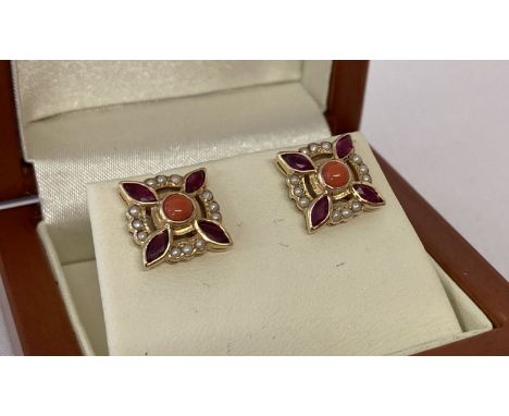 A pair of vintage style ruby, coral and seed pearl stud style earrings by Luke Stockley, London. Full hallmarks to posts and 