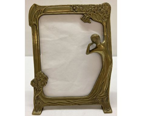 A vintage brass Art Nouveau style, freestanding brass picture frame with black baize to reverse.  Approx. 23.5cm tall.
