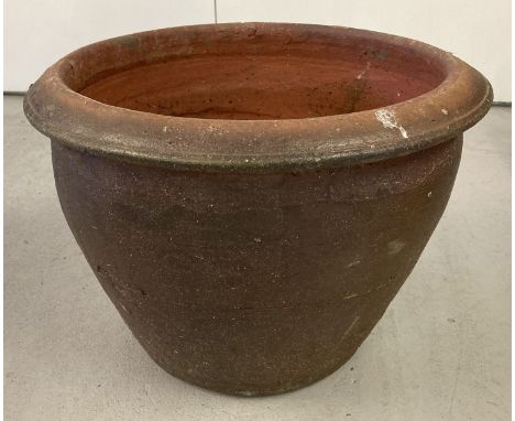 A large terracotta garden planter.  Approx. 35cm tall x 48cm diameter.