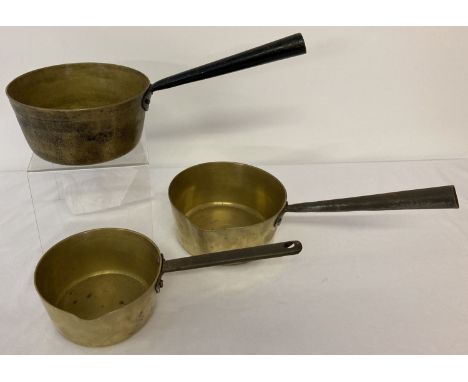 2 vintage brass pouring pans together with a brass saucepan.  Largest pan approx 18cm diameter.