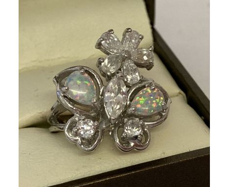 A 925 silver dress ring set with cubic zirconia and opal stones in the shape of a butterfly &amp; flower  Ring size O.