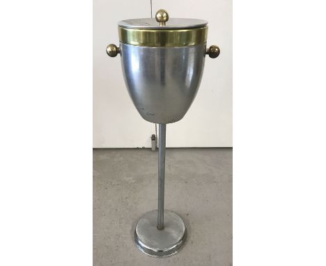 A vintage aluminium and brass effect hotel champagne/ice bucket on a pedestal stand. Complete with plastic liner. Approx. 78c