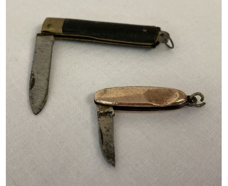 2 miniature vintage penknives, one with 9ct gold casing. Approx. 7cm and 4.5cm long with blade extended. 
