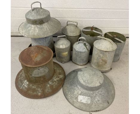 A collection of vintage galvanised poultry feeders. To include examples by "Bretshaw" and "Swifts". 