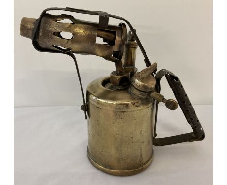 A vintage brass Burmos blow lamp.  Approx. 20cm tall.