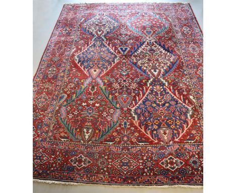 A Persian carpet, Isfahan, made in Iran, numbered 72, l 420 x w 330 cm.