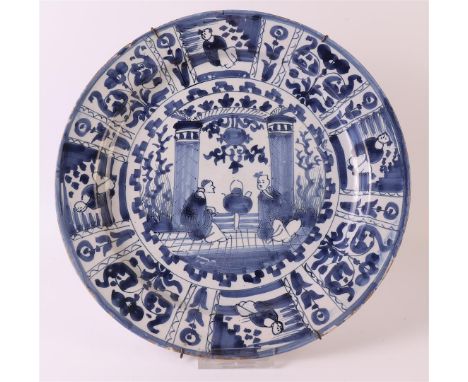 A blue/white Delft earthenware dish, Holland, 18th/19th century. Blue underglaze 'Wanli' cracked decor with two figures in a 