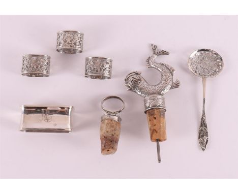 A lot of various silver, including pouring corks with silver frames and finger cloth rings, 20th century, total 164 grams, up