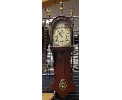 A Frisian tail clock, Friesland, mid 19th century. Oak case, the curved hood is crowned with Atlas and trumpet-blowing angels