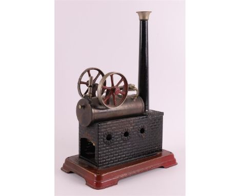 A tin steam engine, 1st half of the 20th century, h 29 x l 20 x w 11.5 cm. .
