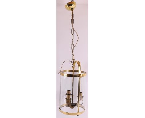 A cylindrical glass hall lamp in a brass frame, after an antique example, France, 2nd half of the 20th century, h 45 cm.
