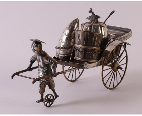 A silver rickshaw as salt and pepper set, China, republic, early 20th century, h 11 x l 19.5 x w 8.5 cm.