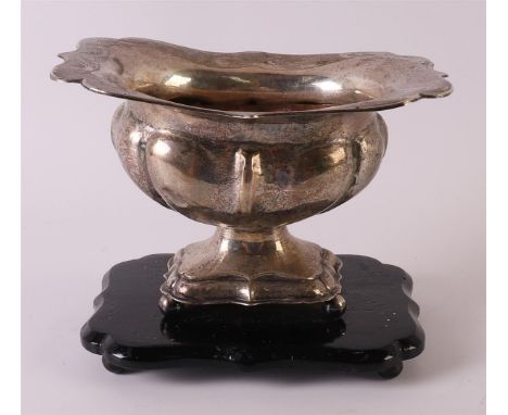 A second grade 835/1000 silver pipe brazier with folded contoured edge, lobed body and base, built in 1857. On blackened wood