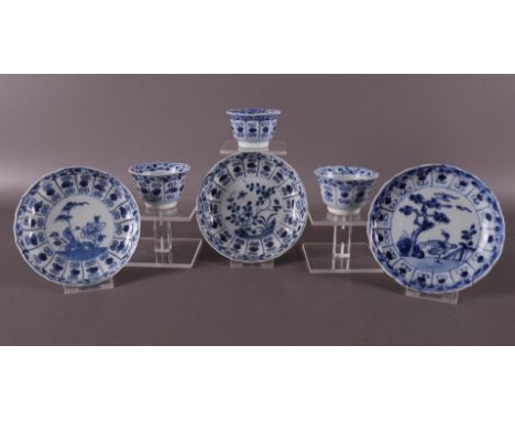 Three blue/white porcelain cups and saucers, China, Kangxi, around 1700. Blue underglaze decoration in cartouches, tot. 6x (f