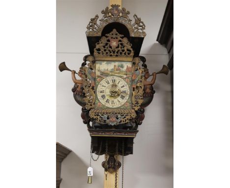 A chair clock, Friesland 20th century. Polychrome decorated wooden chair with cut-out mermaids as cheeks. The hood and the at