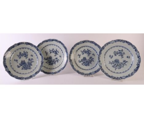 Four blue/white porcelain contoured plates, China, Qianlong (1736-1795). Blue underglaze floral decor on the shelf, the lip w