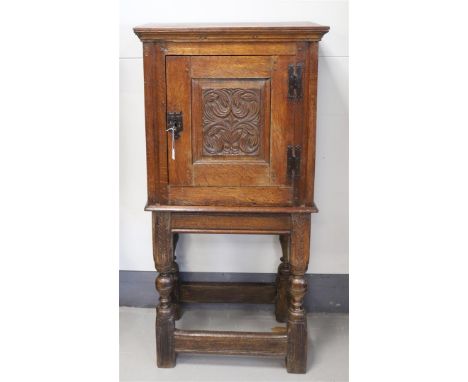 A one-door cupboard, Holland, 18th century and later (composite). Oak wood, straight hood, door with carved panel with styliz