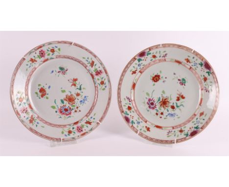 A pair of porcelain famille rose plates, China, Kangxi, around 1700. Polychrome floral decor including peonies on the shelf, 