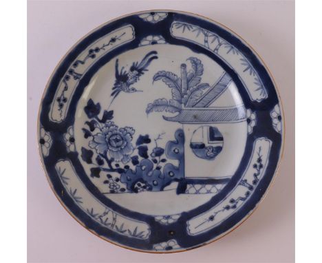 A blue/white porcelain dish with the decor 'Cuckoo in the house', China, Qianlong, 1st half of the 18th century. Blue undergl