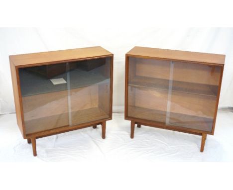 PAIR OF 1960's BEAVER & TAPLEY 'MULTI-WIDTH FITTING FURNITURE' TEAK DISPLAY CABINETeach with a pair of glass sliding doors re