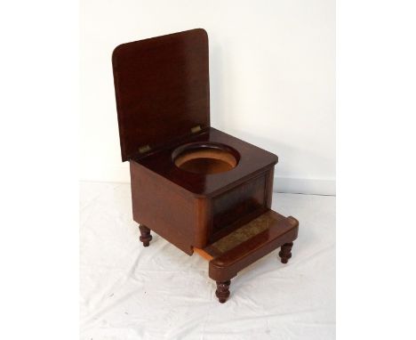 LATE VICTORIAN MAHOGANY STEP COMMODEwith a lift up lid and circular recess for the pot, above a pull out step, standing on tu