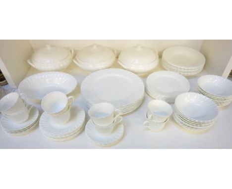 WEDGWOOD BONE CHINA TEA/DINNER SERVICEin white, comprising eight cups; eight saucers; eight side plates; three tureens with c