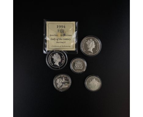 A collection of five silver proof commemorative coins to include New Zealand, Barbados and Fiji dollars and Chinese Yuan etc.
