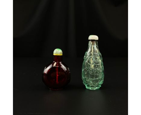 Two Chinese glass snuff bottles, possibly Imperial 18th century and later, to include a ruby red faceted bottle with a jadeit