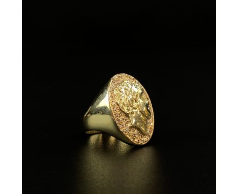 A hallmarked 14ct gold signet ring having a portrait in relief of a Roman emperor in an oval cartouche inset with a surround 