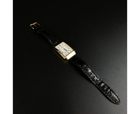 A hallmarked 18ct gold Stellamaris gentleman's watch having a square enamelled dial bearing stylised numerals in a shaped sur