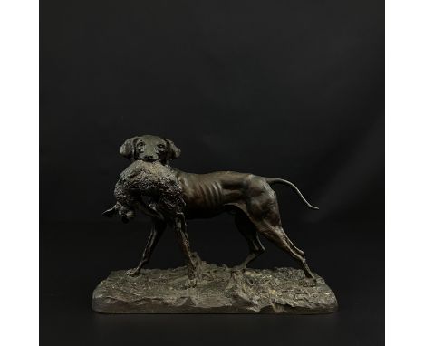 In the manner of Pierre Jules Mene (1810-1879), a patinated bronze figure group of a hunting dog and hare on a naturalistic b