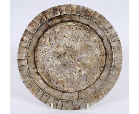 An Indo-Portuguese Goan plate, mounted with mother of pearl, with silver coloured metal mounts and pins, 24.5 cm diameter See