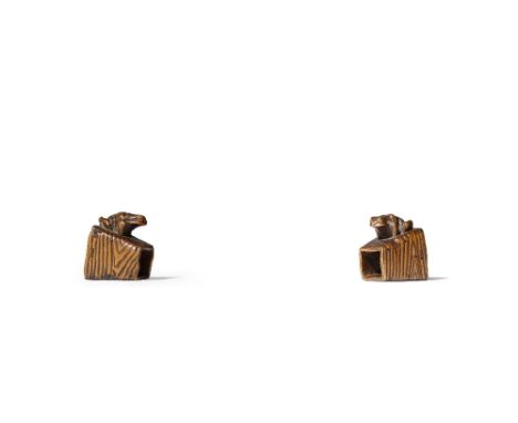 A JAPANESE WOOD NETSUKE OF A FROG MEIJI PERIOD, 19TH CENTURY Realistically carved, the small amphibian dozing off on top of a