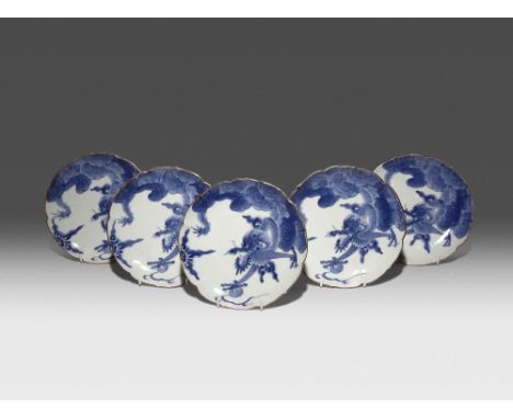 FIVE JAPANESE ARITA BLUE AND WHITE DISHES EDO PERIOD, 18TH CENTURY The foliate bodies decorated with fierce-looking dragons e