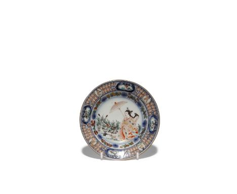 A JAPANESE 'LADY WITH PARASOL' SAUCER DISH EDO PERIOD, C.1730-40 After the Cornelis Pronk design, painted in underglaze blue,