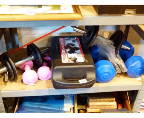 Shelf of training weights and dumbells