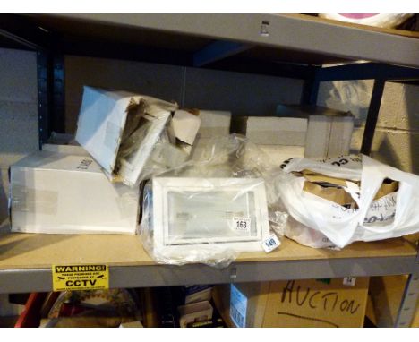 Shelf of boxed electrical flood lights