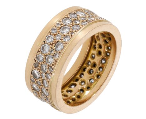 A diamond eternity ring, pavé-set throughout with graduated brilliant-cut diamonds, stamped ‘750’, total diamond weight appro