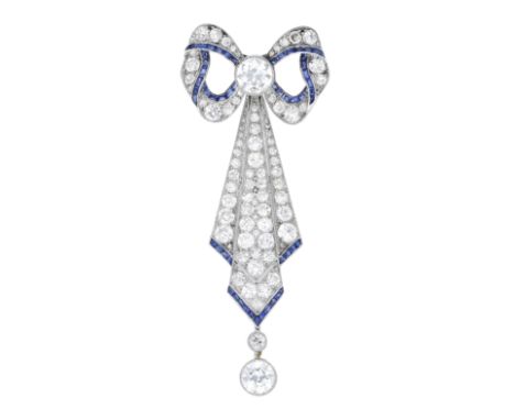 An early 20th century sapphire and diamond brooch, the sculptural bow above a tiered panel suspending two graduated diamond d