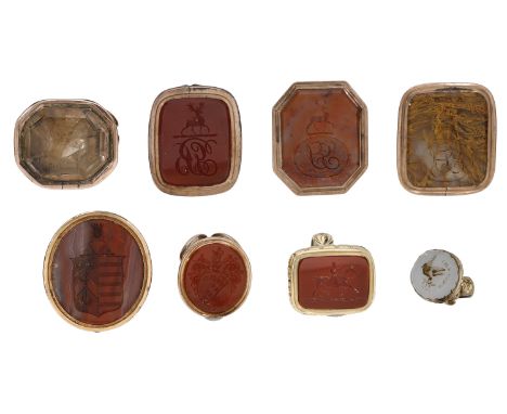 A collection of antique fob seals, including three fluted hardstone examples, with various crest and monogram engravings, gol