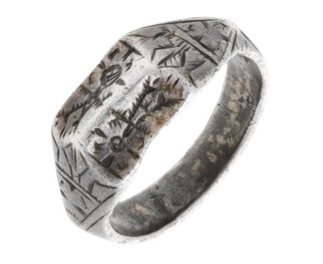 A silver gilt ring, 15th / 16th century, the bifacial ring centrally ridged, with incised flowerhead and foliate decoration t