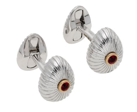 A pair of gem-set cufflinks by House of Fabergé, the egg-shaped terminals with fluted finish and centred with a circular-cut 