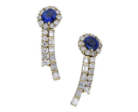 A pair of sapphire and diamond earrings, the sapphire and diamond cluster surmounts diagonally set above two fixed drops, sli